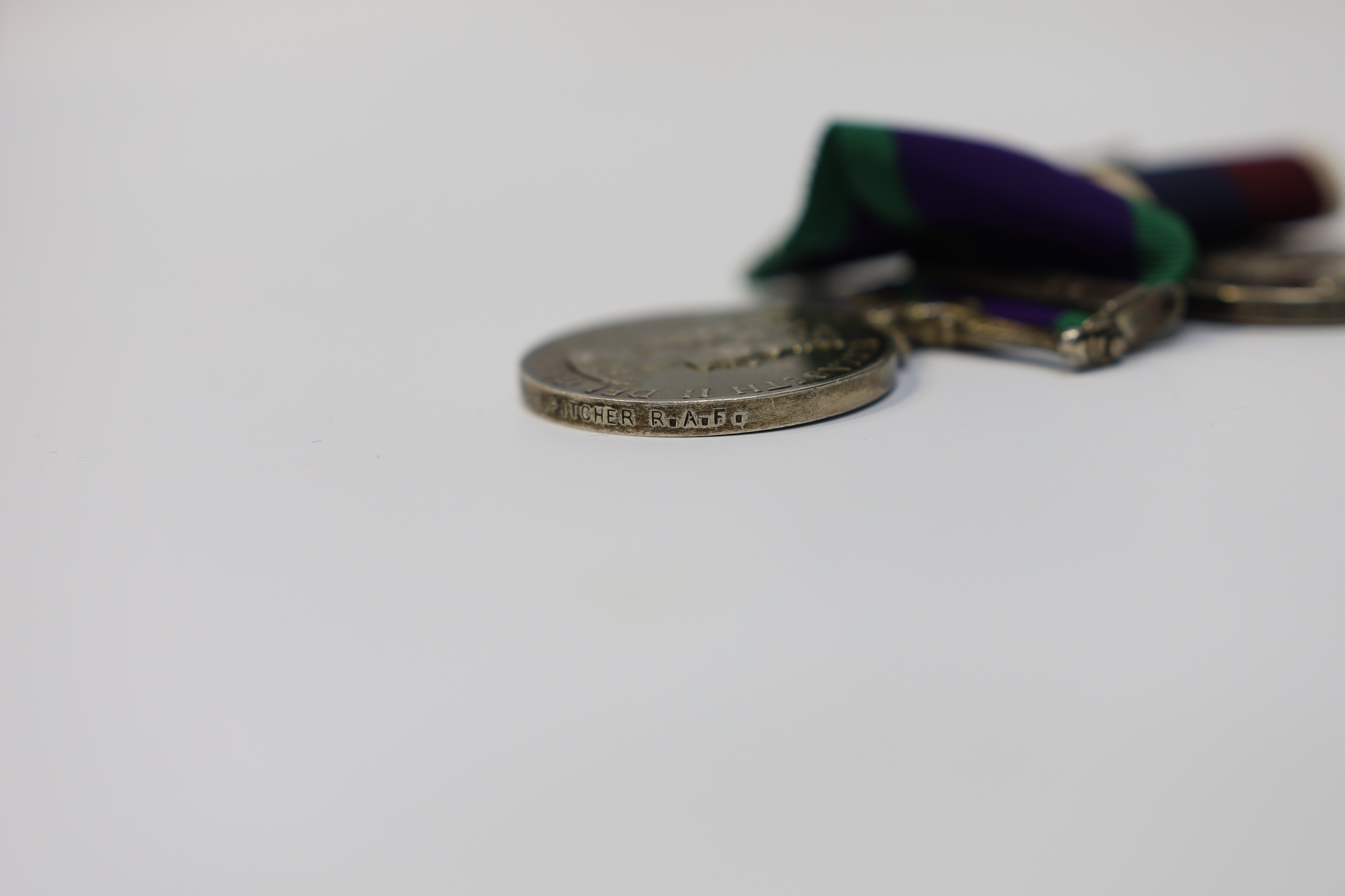 An ERII RAF medal pair awarded to Cpl. A.F.G. Pitcher RAF, comprising; a General Service Medal with a bar for Borneo and an RAF Long Service Medal, mounted on a common pin. Condition - fair to good